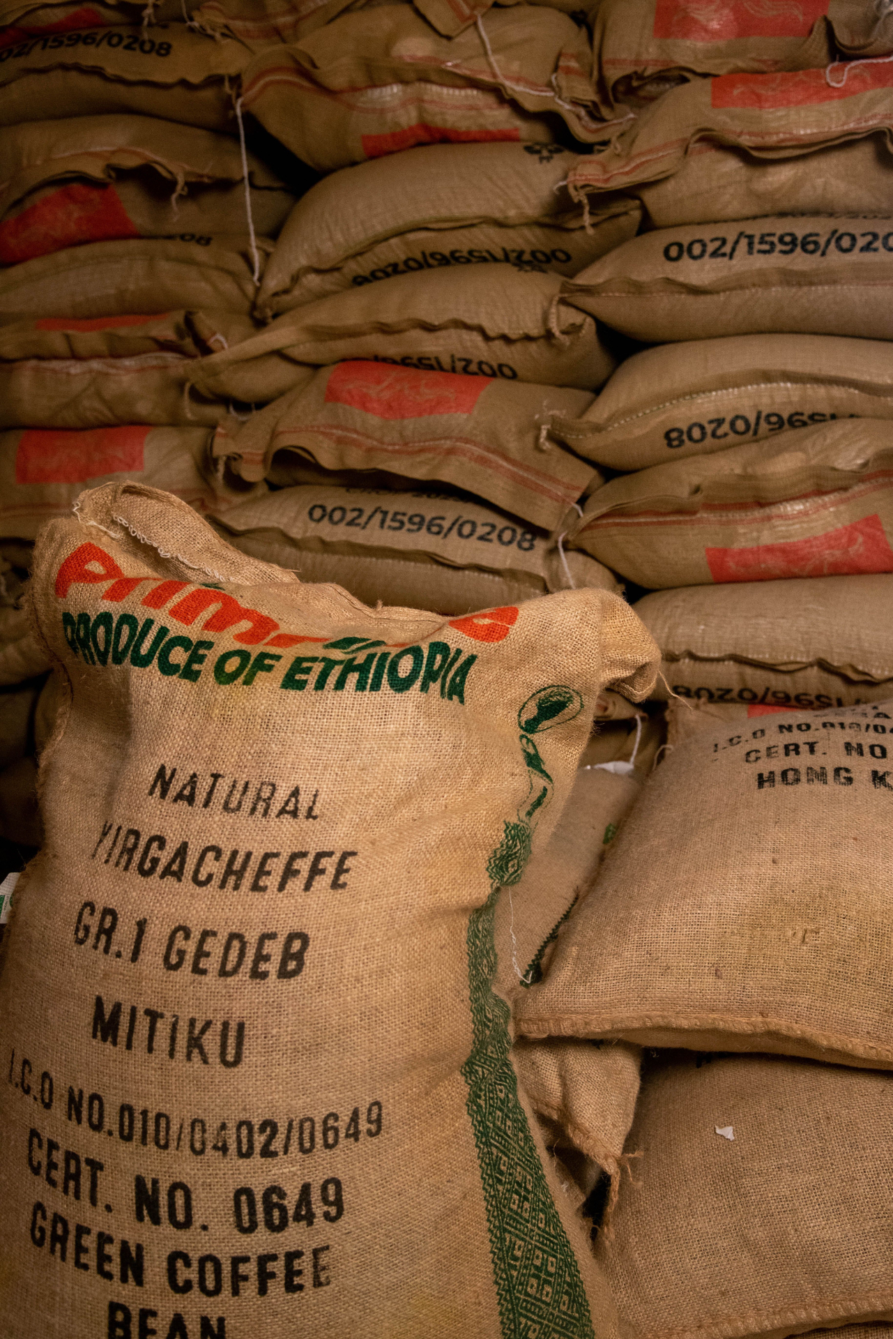 Stacked burlap sacks of Ethiopian green coffee