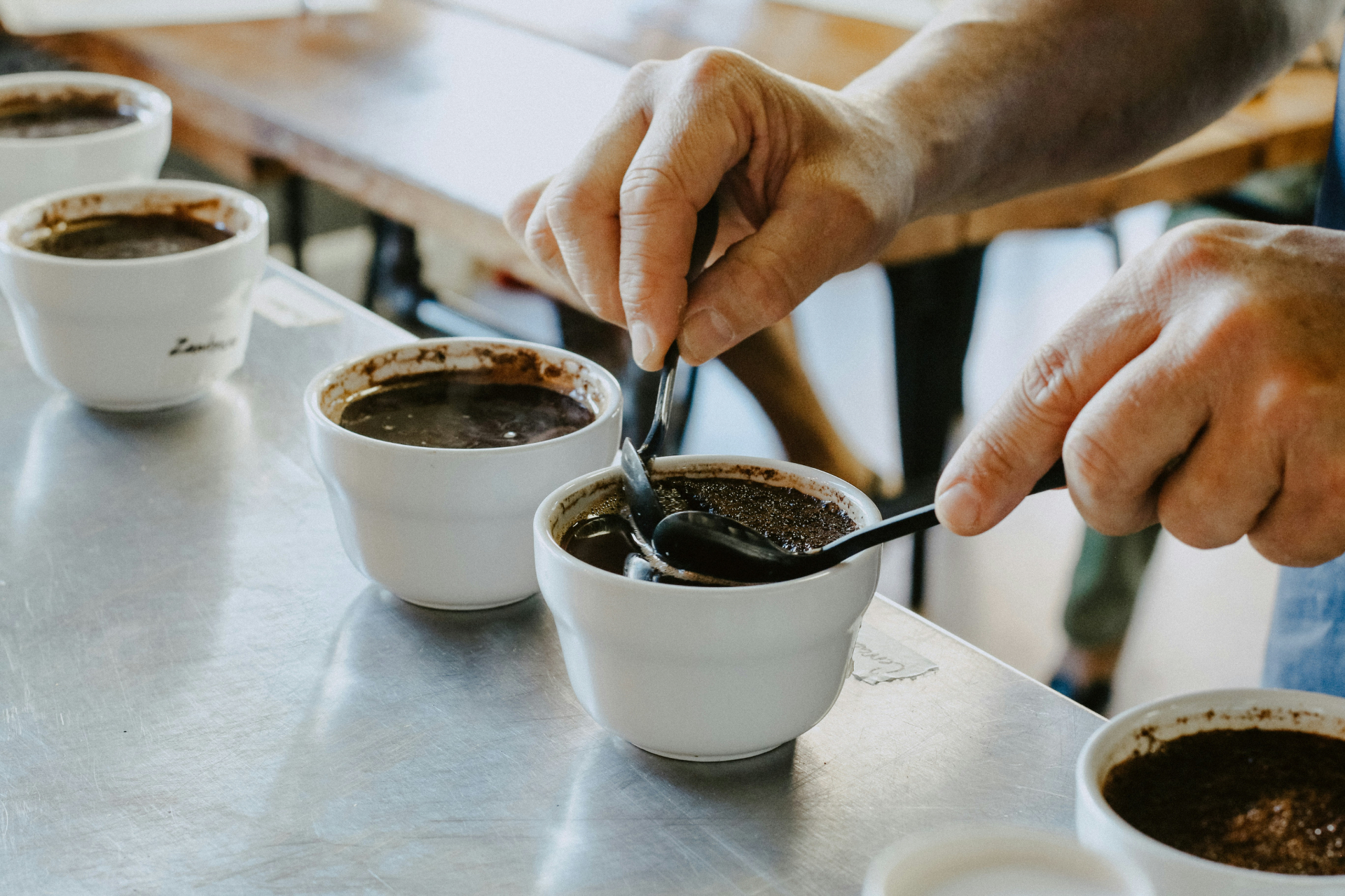 Cupping session with coffee samples and spoons